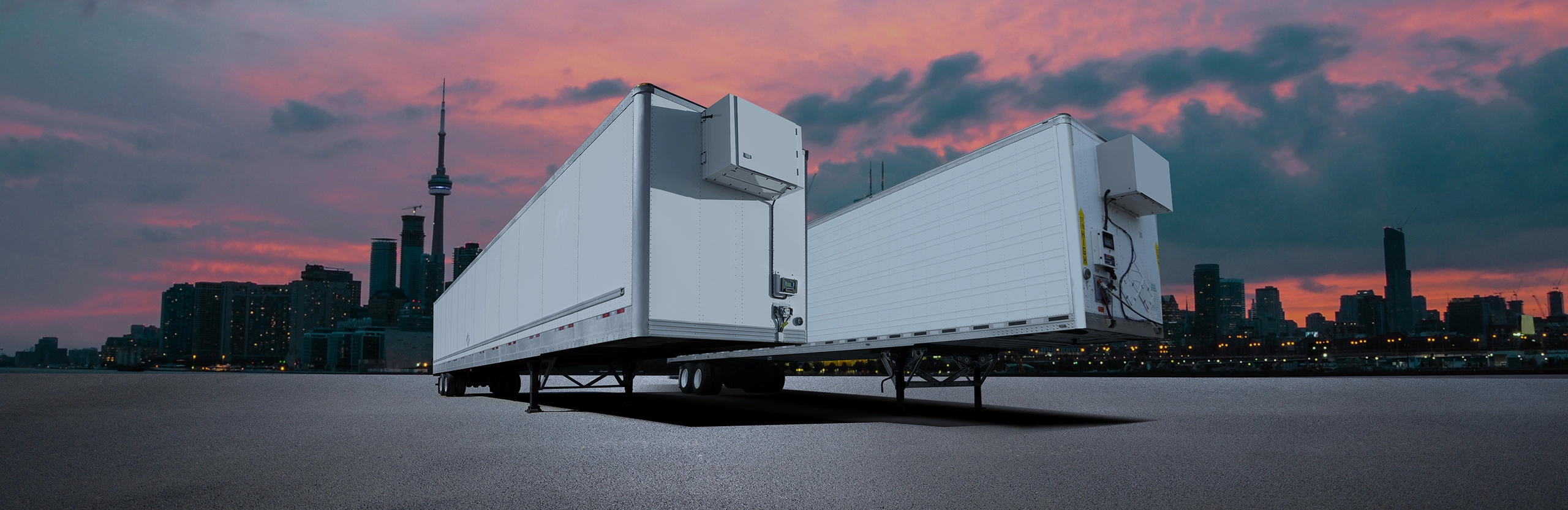 Heated trailers parked in front of Toronto skyline