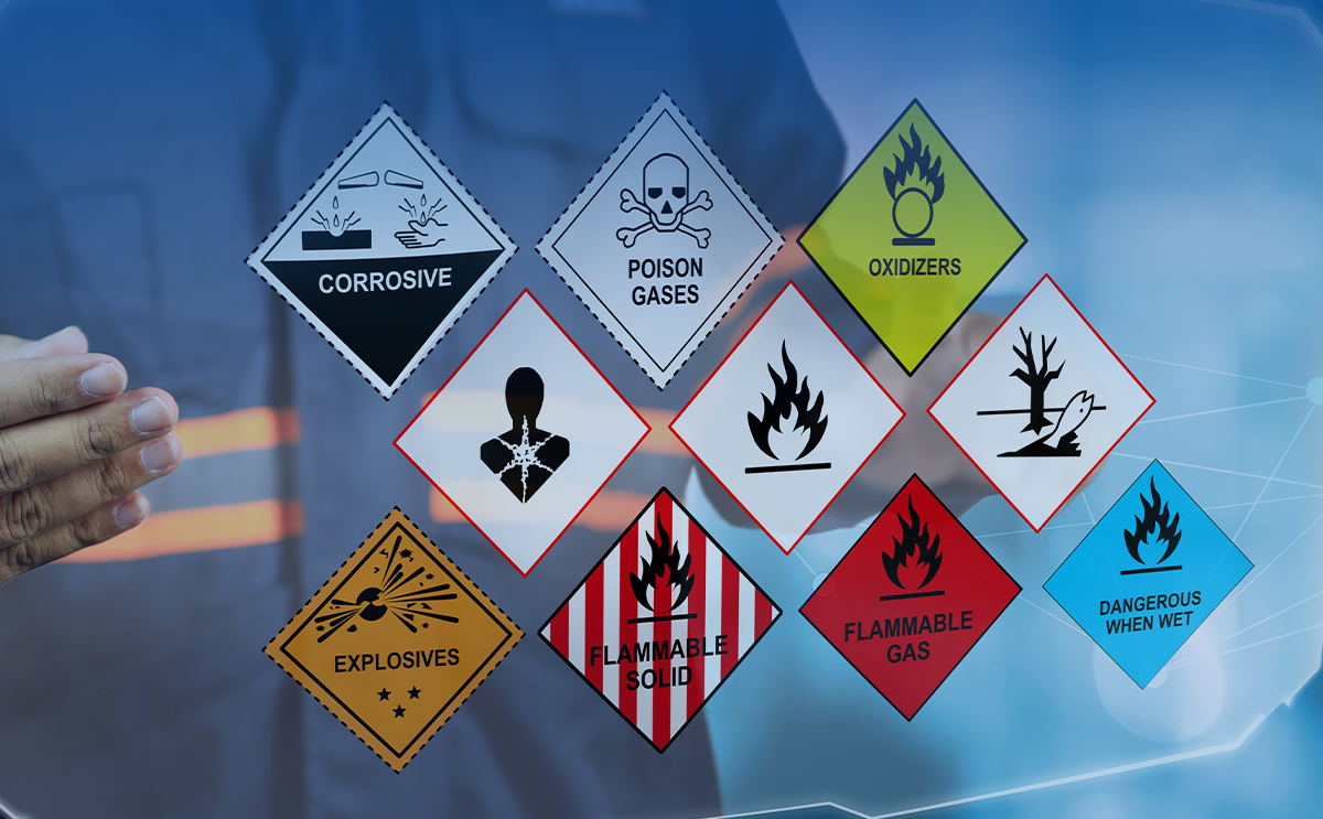 Man holding sheet with specialty hazmat and non-hazmat chemical labels